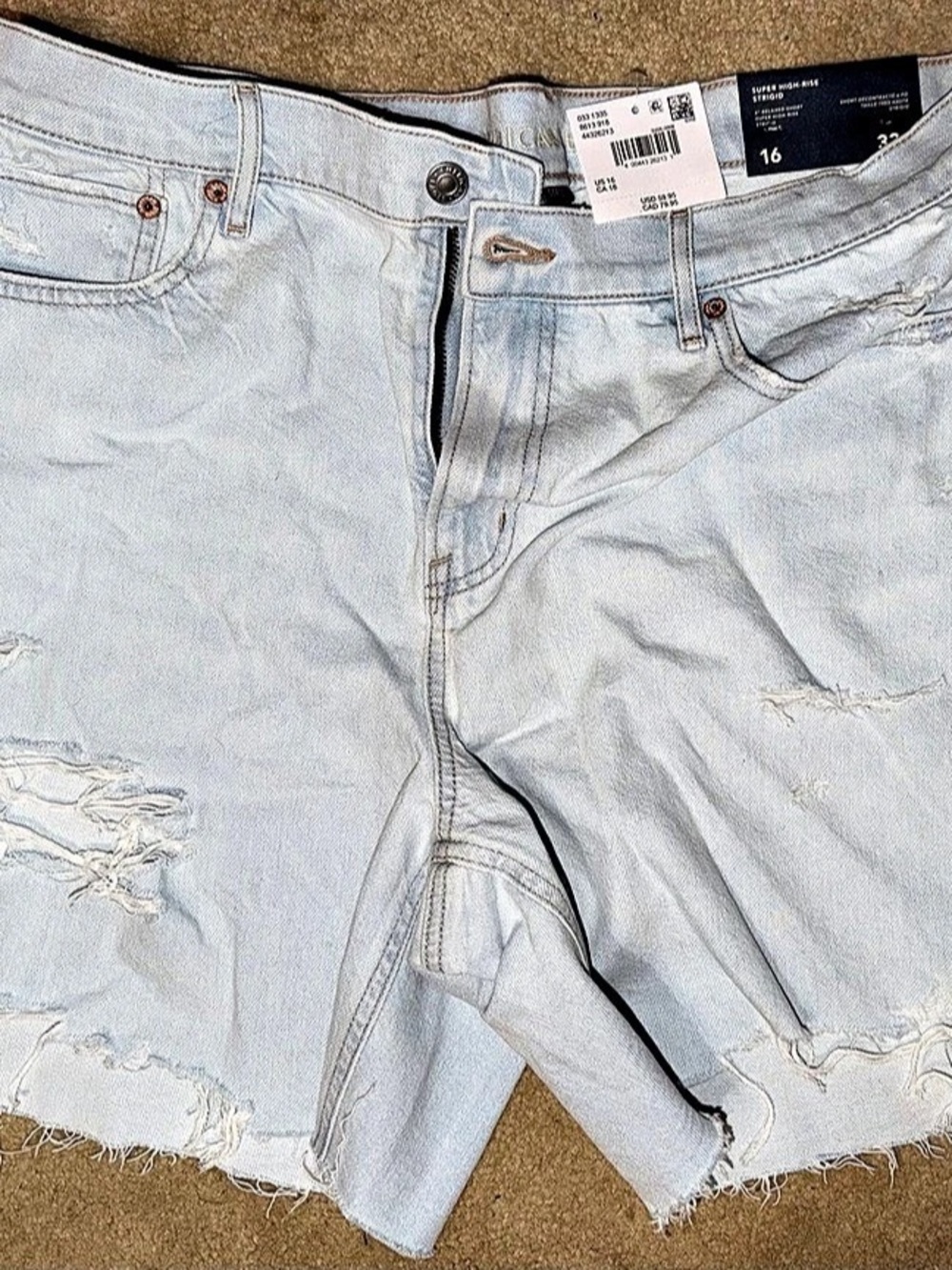 American Eagle Relaxed Fit Jean Shorts. Distressed Blue Jean Shorts Waist 33 -